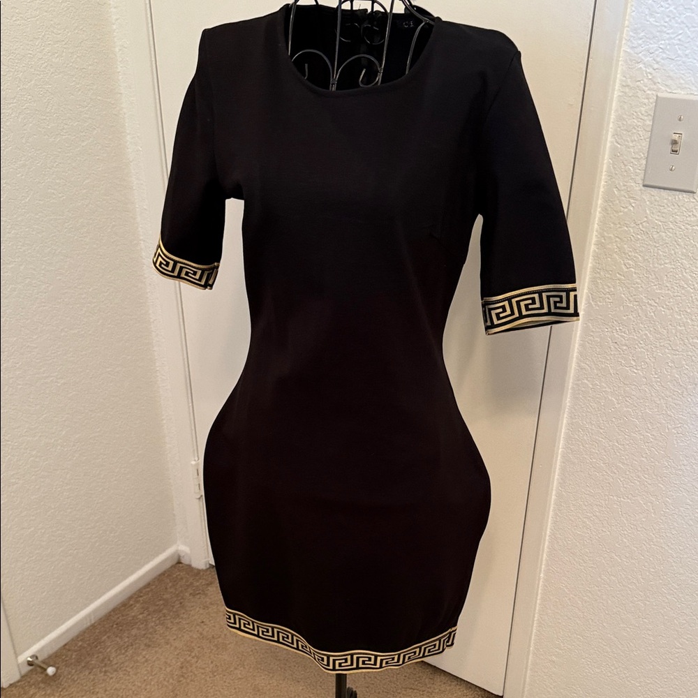 Chic Black Dress with Gold Trim